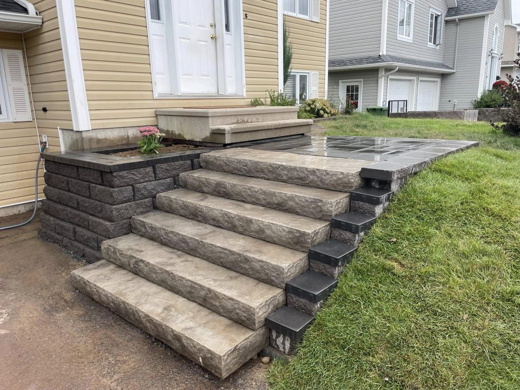 An image of a well-constructed outdoor staircase leading up to a house entrance.